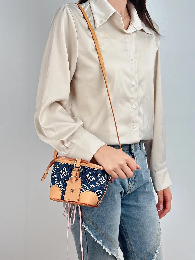 Louis Vuitton Crossbody Bag NOÉ PURSE 1854 Mini 11.5 × 11.5 × 12 cm — on-model view 2 of 2