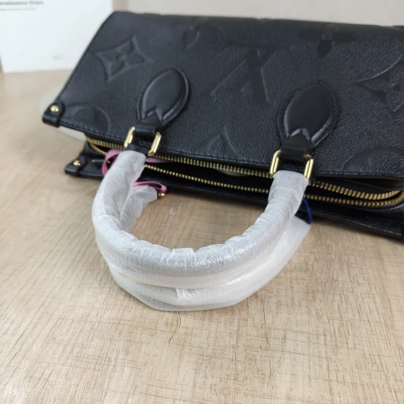 Louis Vuitton Crossbody Bag Onthego East West Two Straps Black Empreinte Embossed Calfskin Small 25 × 10 × 13 cm — detail view 9 of 12