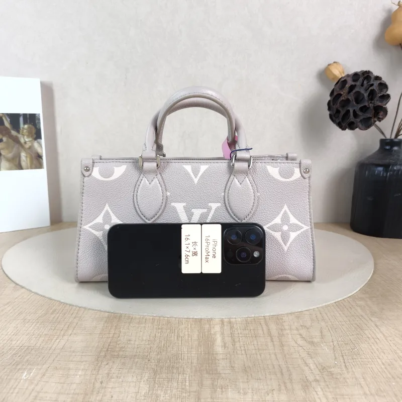 Louis Vuitton Crossbody Bag Onthego East West Two Straps Grey Monogram Empreinte Embossed Calfskin Small 25 × 10 × 13 cm — cover view 4 of 5