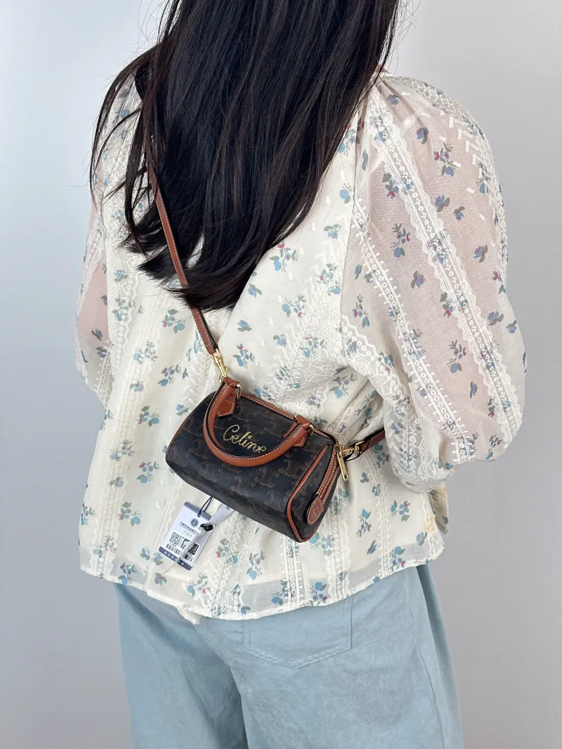 CELINE Crossbody Bag Monogram PV Cmini14 × 7.5 × 9.5 cm — on-model view 1 of 3