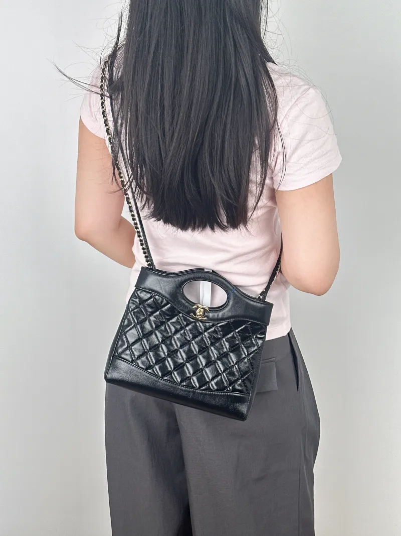 Chanel Crossbody Bag31Bag Black Waxed Leathermini23 × 5.5 × 22 cm — on-model view 2 of 2