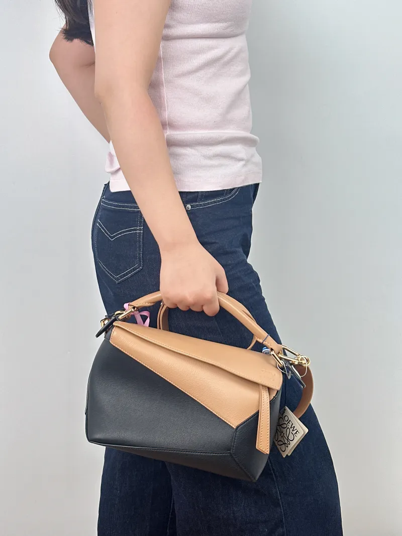 LOEWE Crossbody Bag Puzzle Brown Black CC alfskin Small 24 × 10.5 × 16.5 cm — on-model view 2 of 2