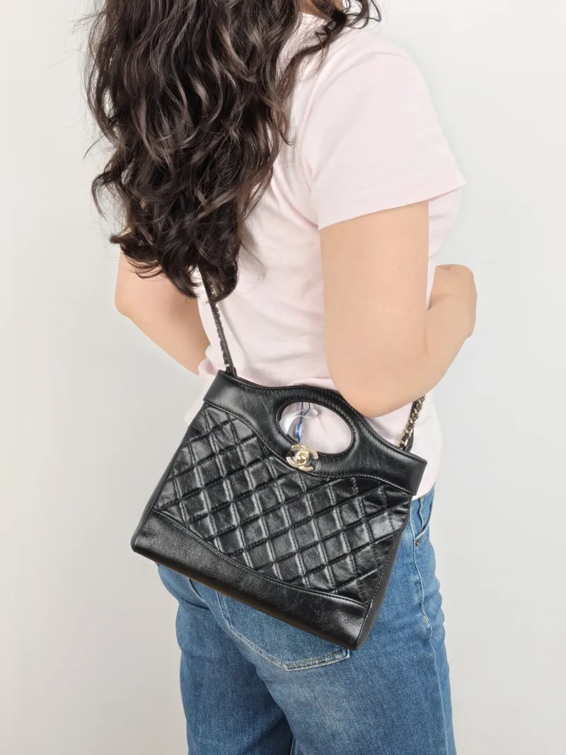 Chanel Crossbody Bag 31Bag Black Waxed Leather Mini 23 × 5.5 × 22 cm — on-model view 2 of 2