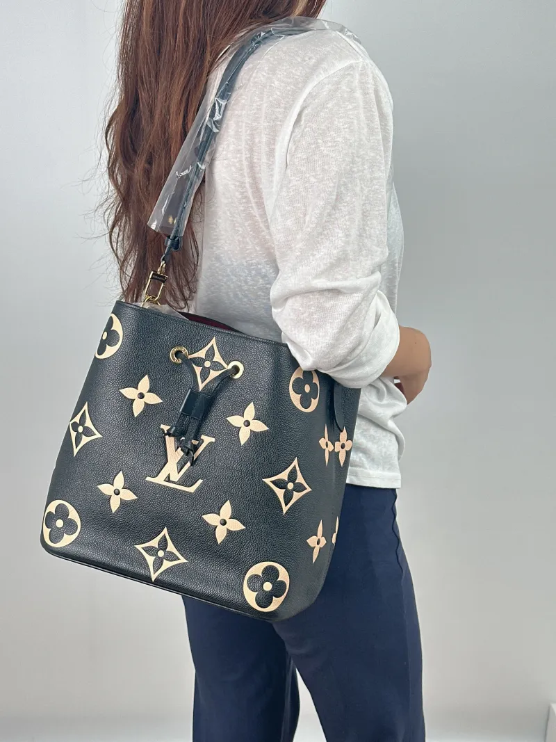 Louis Vuitton Shoulder Bag NÉONOÉ Bucket Bag Black · White Monogram Empreinte Embossed Calfskin Medium 26 × 17.5 × 26 cm — on-model view 1 of 2