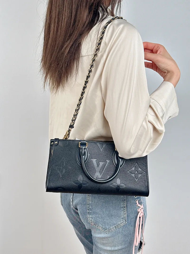 Louis Vuitton Crossbody Bag Onthego East West Two Straps Black Monogram Empreinte Embossed Calfskin Small 25 × 10 × 13 cm — on-model view 3 of 3