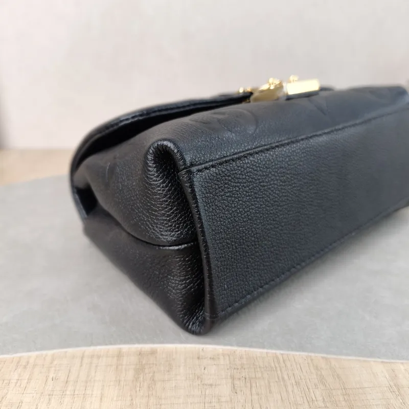 Louis Vuitton Crossbody Bag MADELEINE Black Monogram Empreinte Embossed Calfskin BB 24 × 8.5 × 17 cm — detail view 12 of 12