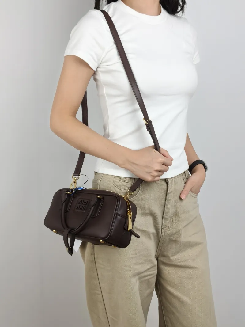 Miumiu Top Handle Bag Arcadie Collection Bowling Bag CC alfskin Medium 22 × 7.5 × 10.5 cm — on-model view 1 of 3