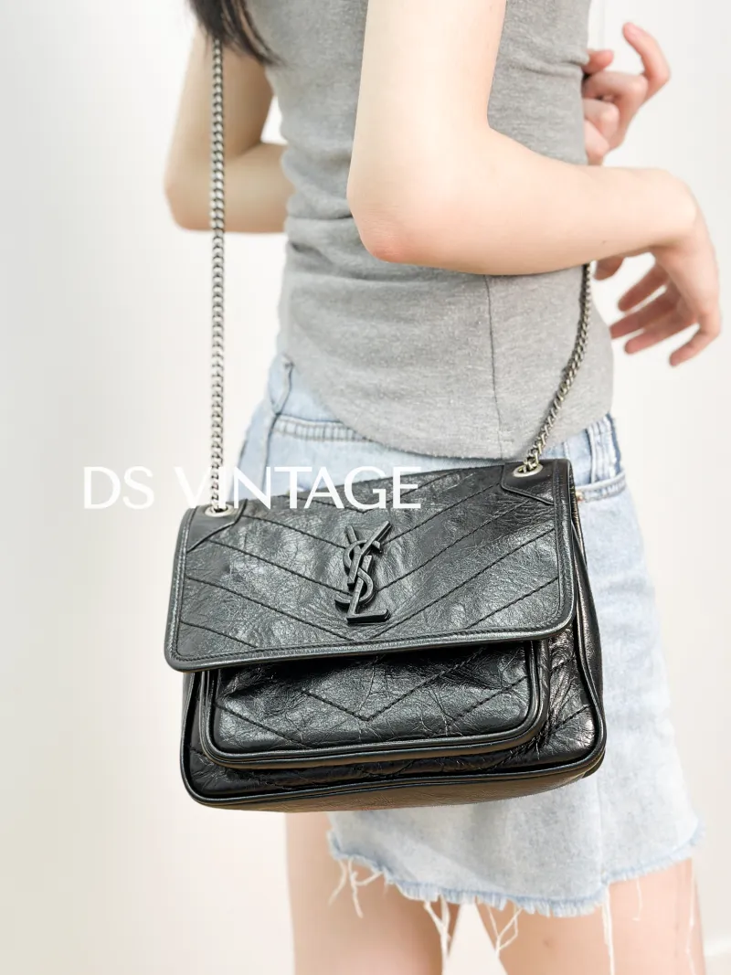 SAINT LAURENT Crossbody Bag Niki Black Waxed Leather Calfskin Small 21 × 7.5 × 16 cm — on-model view 2 of 3