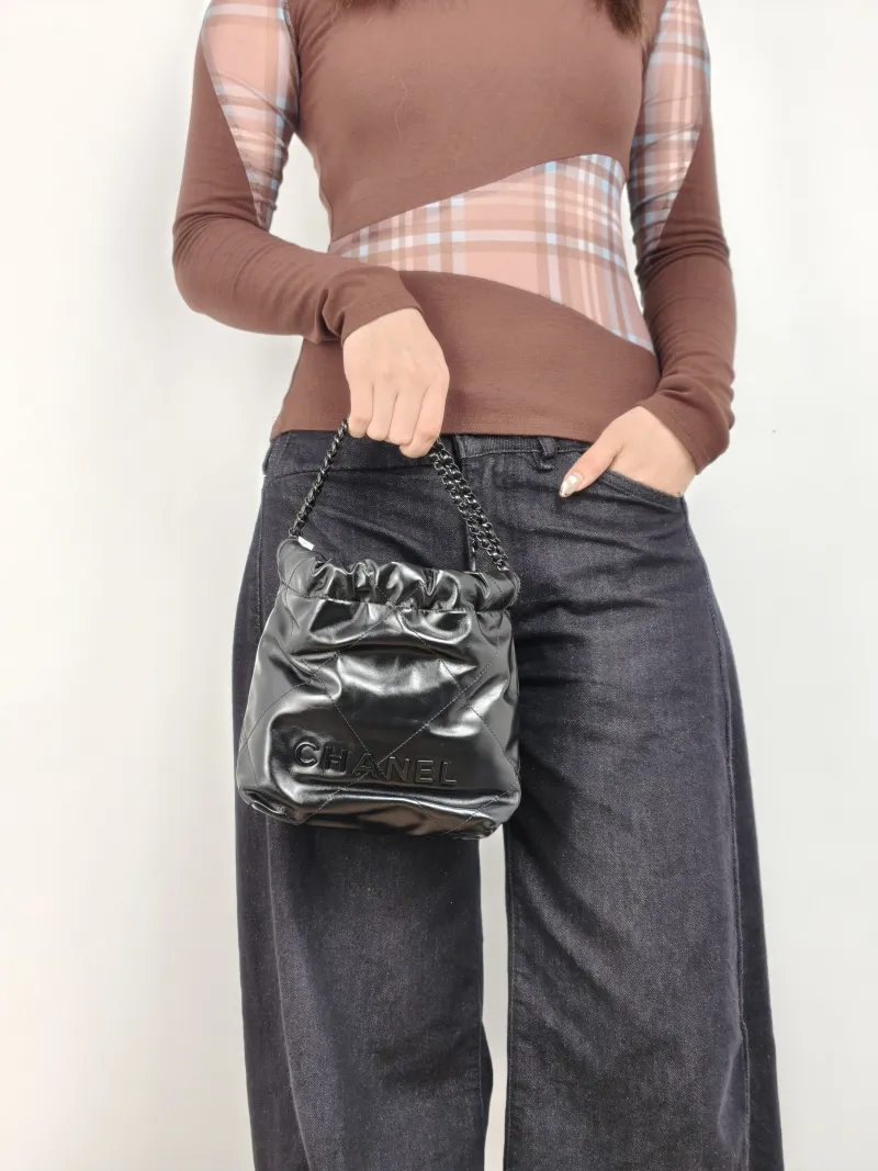 Chanel Shoulder Bag 22Bag Black CC alfskin Mini 20 × 6 × 19 cm — on-model view 1 of 2