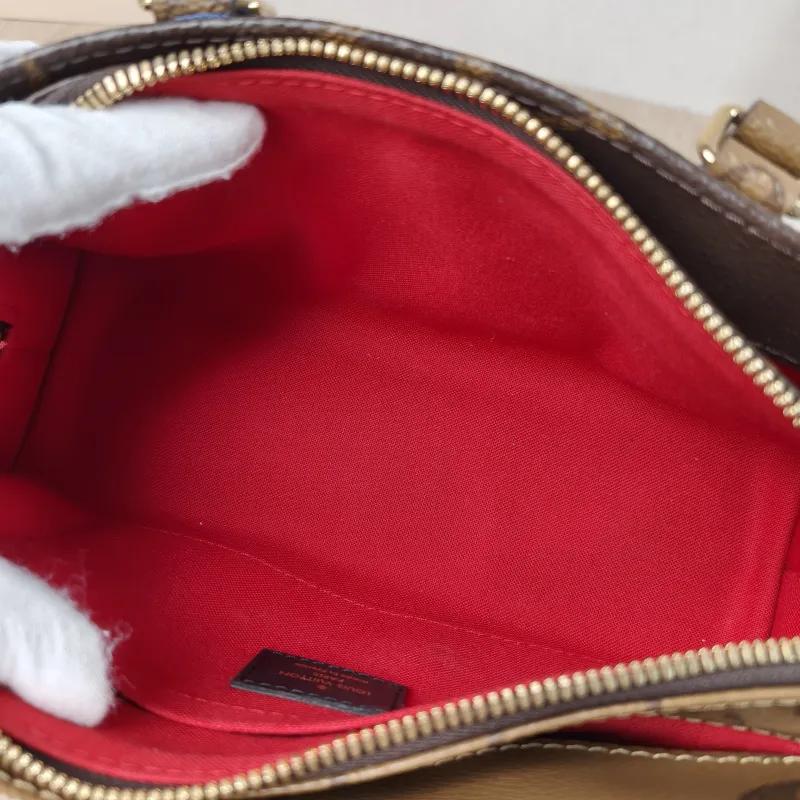 Louis Vuitton Crossbody Bag Onthego East West Monogram PVC Small 25 × 10 × 13 cm — detail view 14 of 16