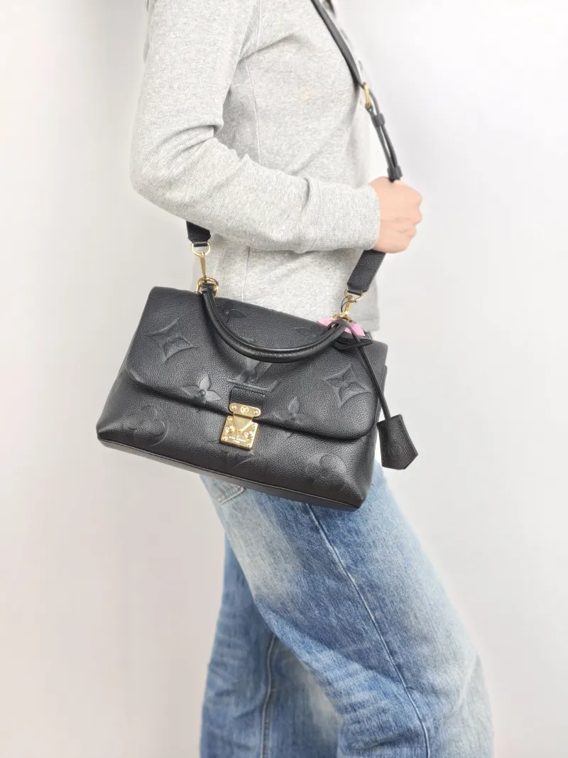Louis Vuitton Crossbody Bag MADELEINE Black Monogram Empreinte Embossed Calfskin Medium 30 × 11 × 19.5 cm — on-model view 3 of 3