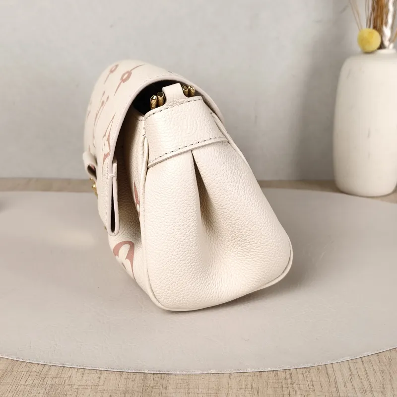 Louis Vuitton Crossbody Bag Favorite White · Pink Empreinte Embossed Calfskin Monogram Medium24 × 9 × 14 cm — detail view 3 of 12