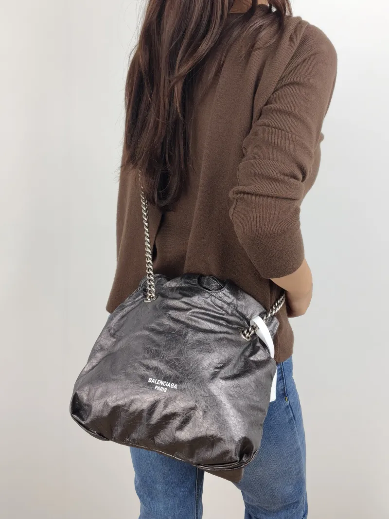 BALENCIAGA Shoulder Bag Crush Calfskin Small 25 × 9 × 26 cm — on-model view 1 of 2