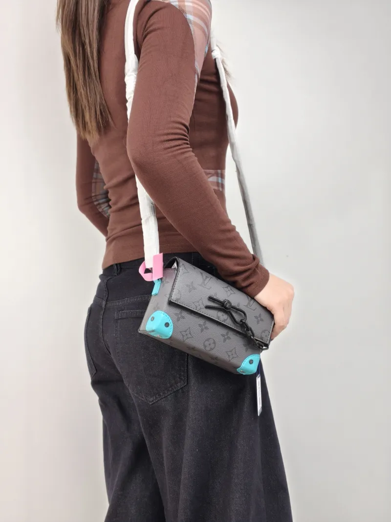 Louis Vuitton Crossbody Bag Steamer Box Grey · Blue PVC · Calfskin Mini 18 × 6.5 × 11 cm — on-model view 1 of 2