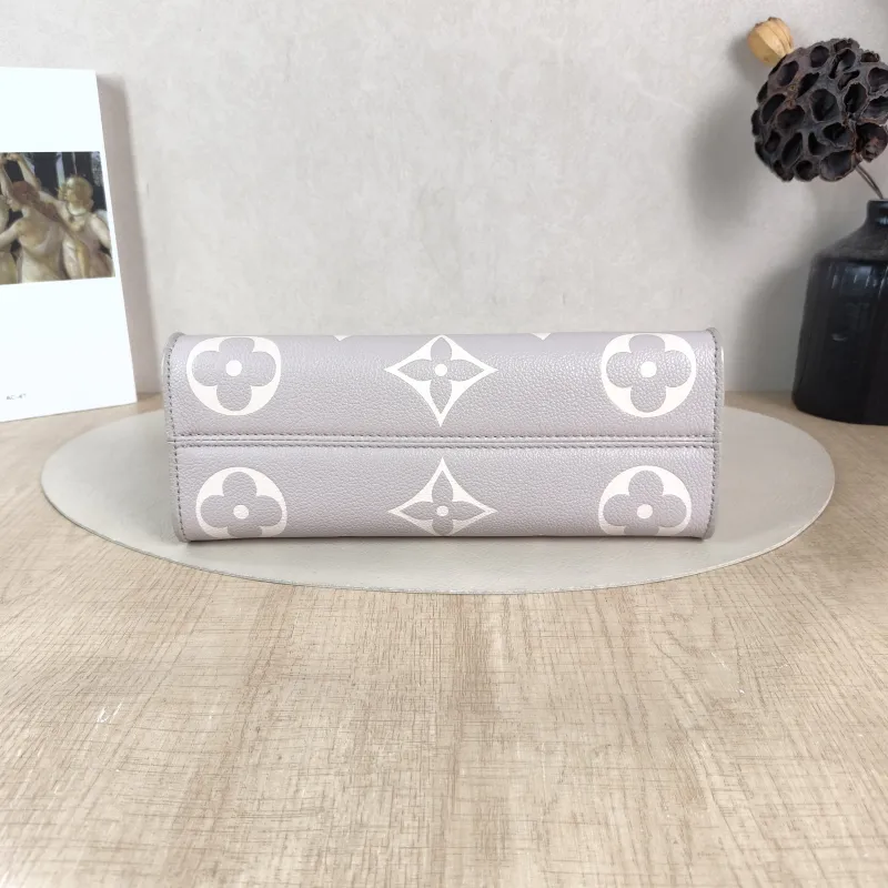 Louis Vuitton Crossbody Bag Onthego East West Two Straps Grey Monogram Empreinte Embossed Calfskin Small 25 × 10 × 13 cm — cover view 2 of 5