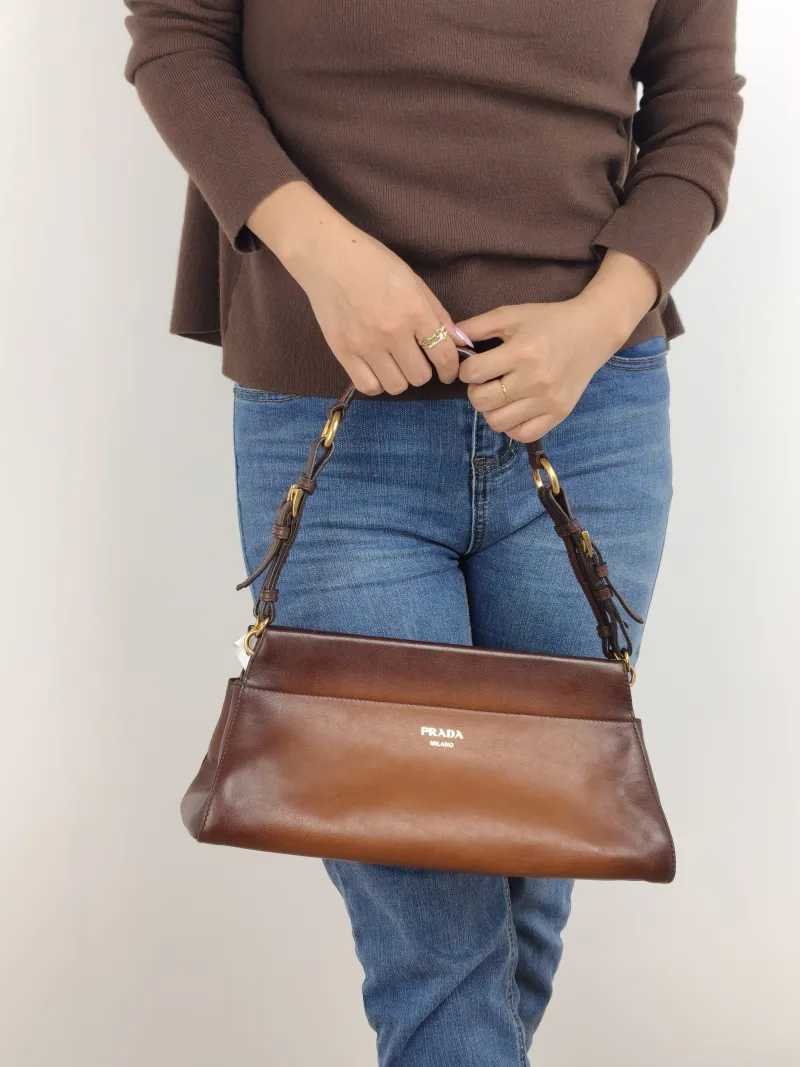 PRADA Shoulder Bag Shoulder Bag Brown Calfskin One Size 32 × 12 × 15 cm — on-model view 1 of 2