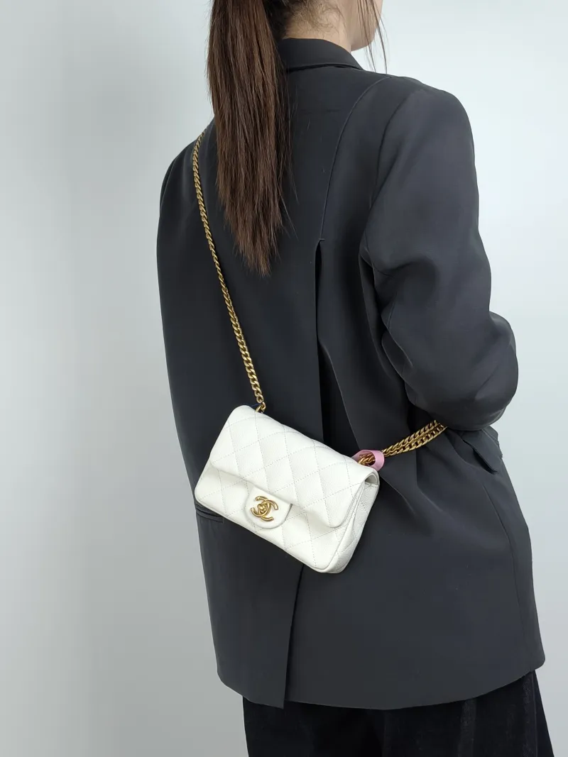 Chanel Crossbody Bag White Grained Calfskin 18 × 5 × 12 cm — on-model view 1 of 2