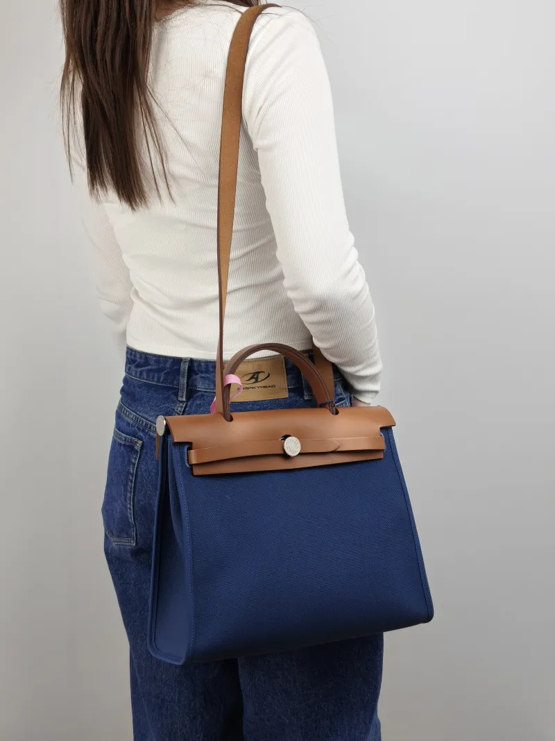 Hermès Crossbody Bag Herbag 31 Blue Caramel Canvas Medium 30.5 × 11 × 25.5 cm Y — on-model view 2 of 2