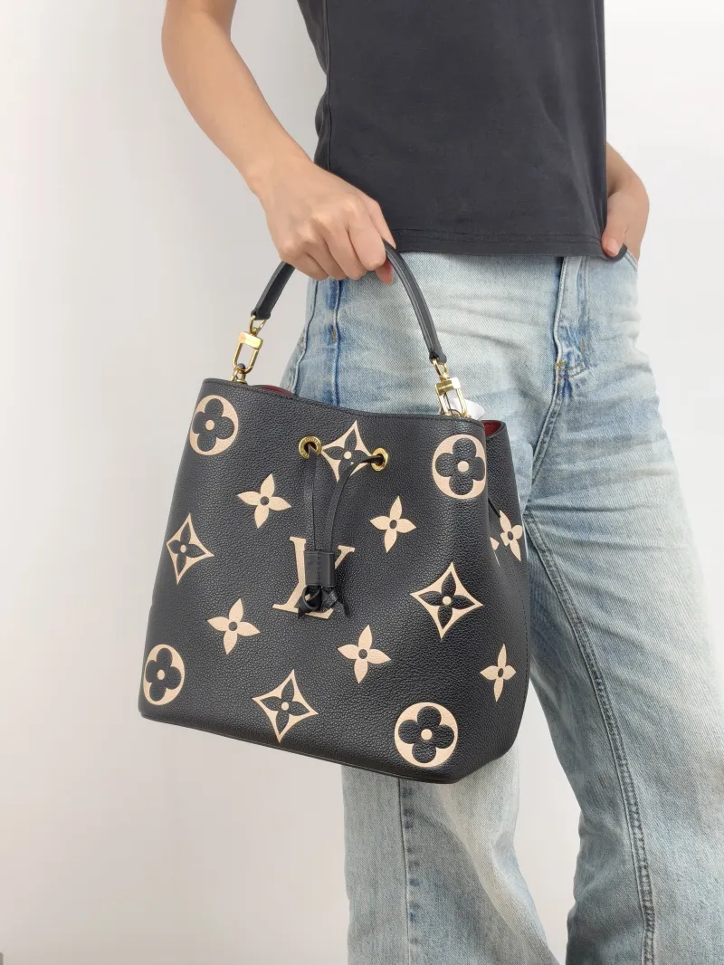 Louis Vuitton Shoulder Bag NÉONOÉ Bucket Bag Black · White Monogram Empreinte Embossed Calfskin Medium 26 × 17.5 × 26 cm — on-model view 3 of 3