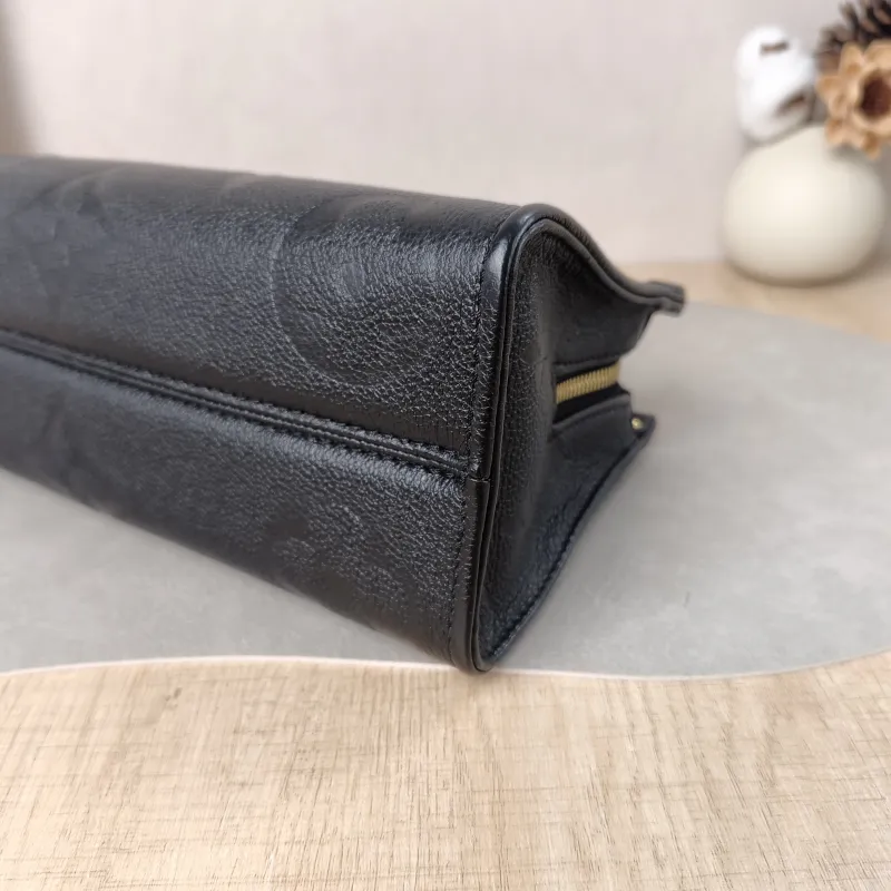 Louis Vuitton Crossbody Bag Onthego East West Two Straps Black Monogram Empreinte Embossed Calfskin Small 25 × 10 × 13 cm — detail view 7 of 11