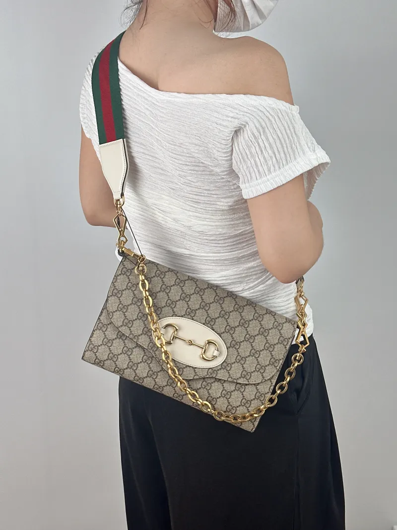 GUCCI Crossbody Bag Horsebit 1955 Two Straps woc Monogram PVC 26 × 3.2 × 16.5 cm — on-model view 2 of 2