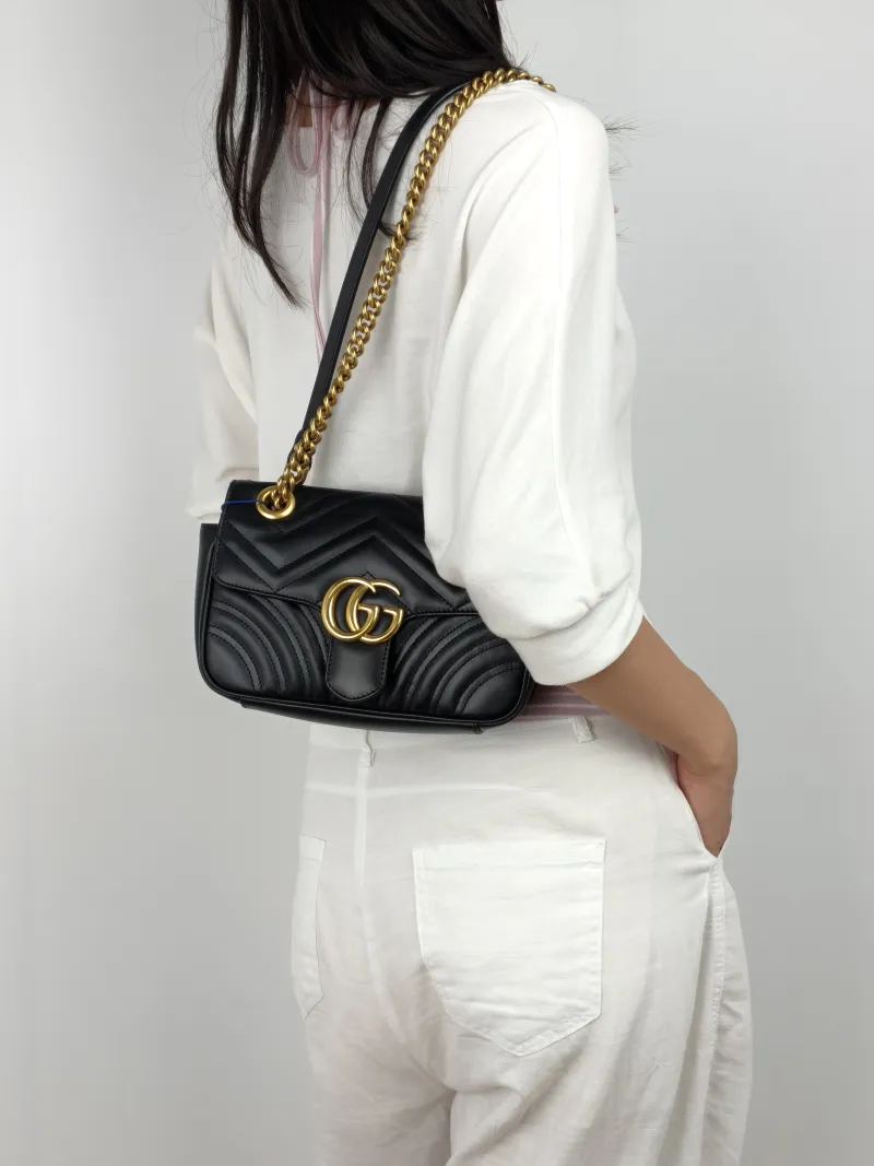 GUCCI Crossbody Bag GG Marmont Small Marmont 22 Black CC alfskin Small 22 × 6 × 13 cm — on-model view 2 of 3