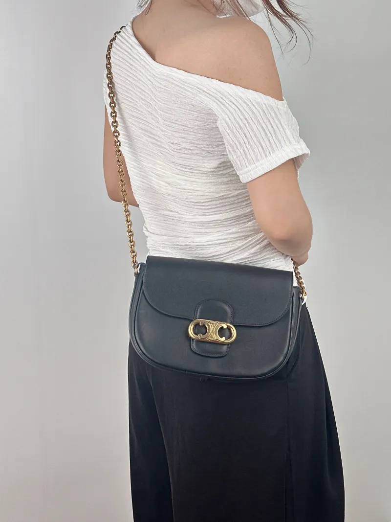 CELINE Crossbody Bag Maillon Triomphe Black Calfskin Medium 22 × 6 × 17 cm — on-model view 1 of 2