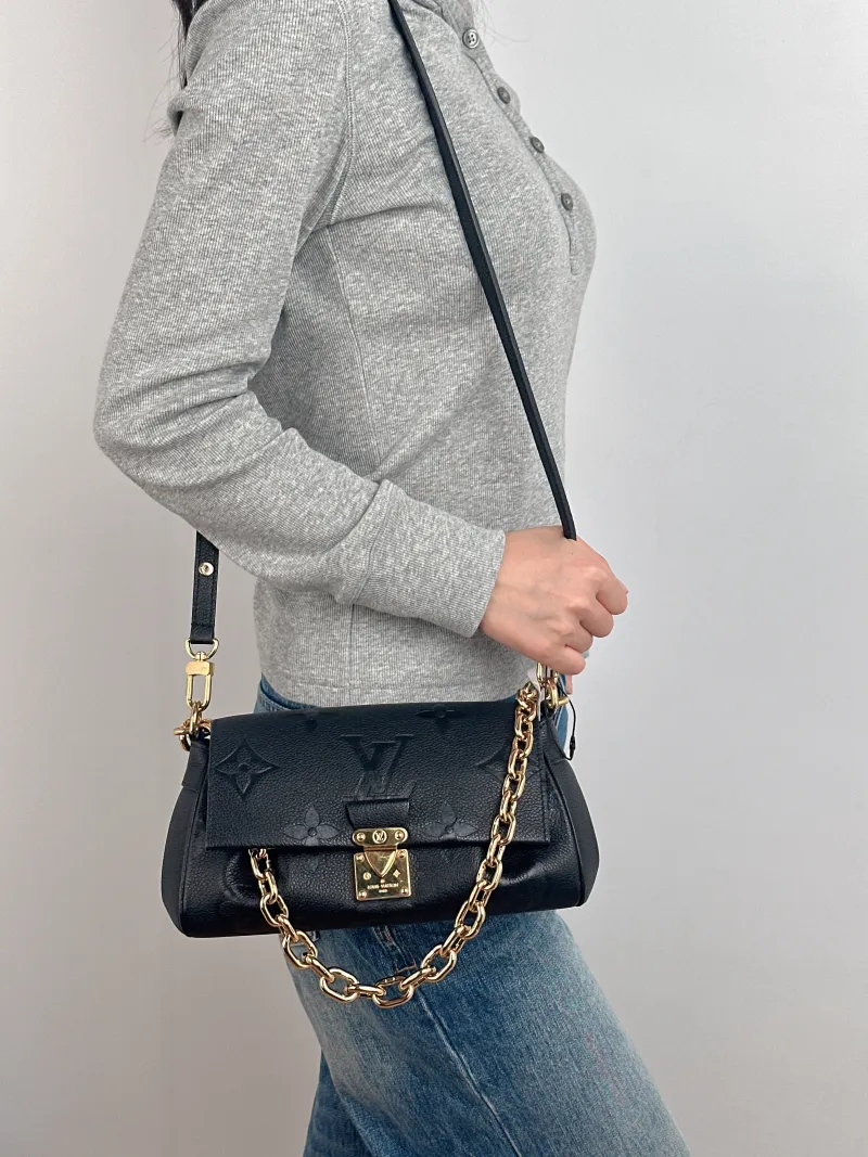 Louis Vuitton Crossbody Bag Favorite Black Monogram Empreinte Embossed Calfskin Medium 24 × 9 × 14 cm — on-model view 2 of 3