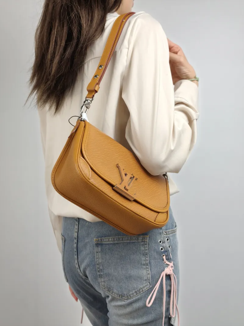 Louis Vuitton Shoulder Bag BUCI Epi Embossed Calfskin 24.5 × 9 × 15.5 cm — on-model view 1 of 2