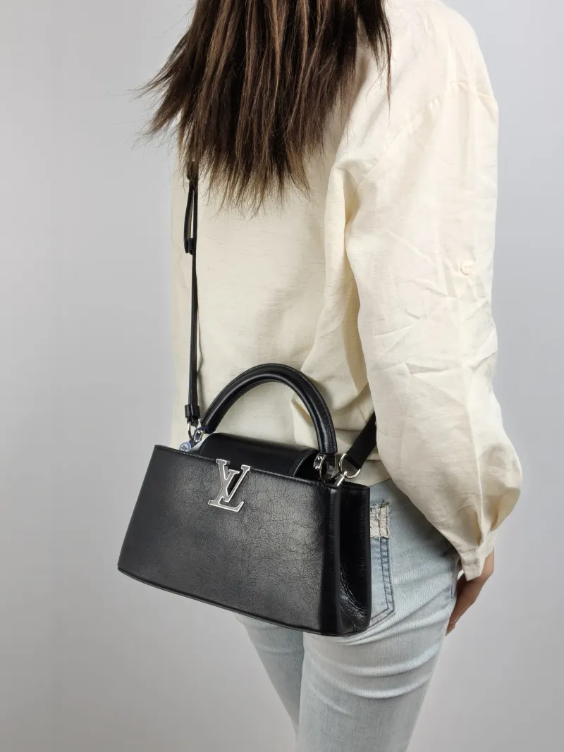 Louis Vuitton Crossbody Bag Capucines East West Black Calfskin BB 26.5 × 8 × 14 cm — on-model view 2 of 3