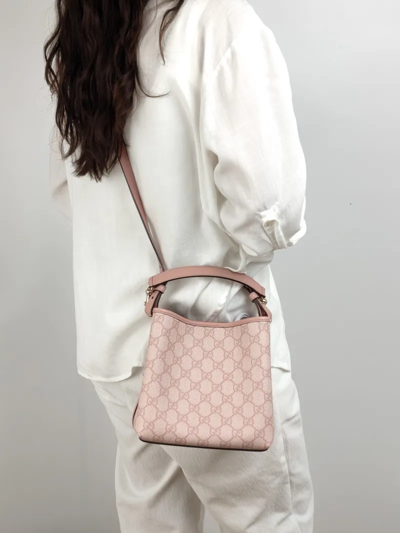 GUCCI Crossbody Bag GG Emblem Pink PVC Small 19 × 11 × 18 cm — on-model view 1 of 2