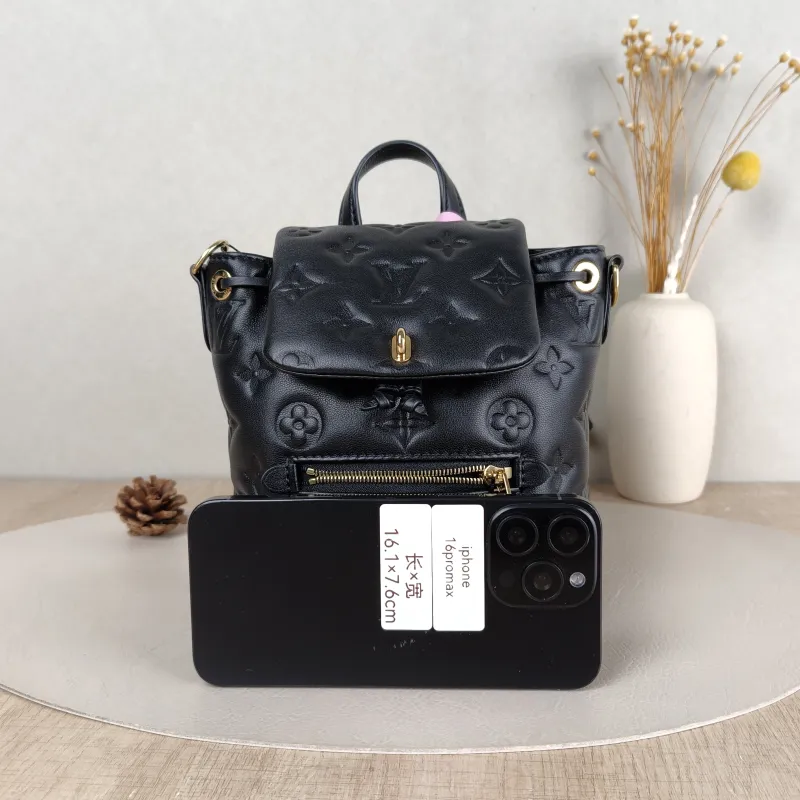 Louis Vuitton Backpack Coussin Backpack Black with Gold-Tone Hardware Lambskin Mini 15 × 7.5 × 20 cm — cover view 5 of 5