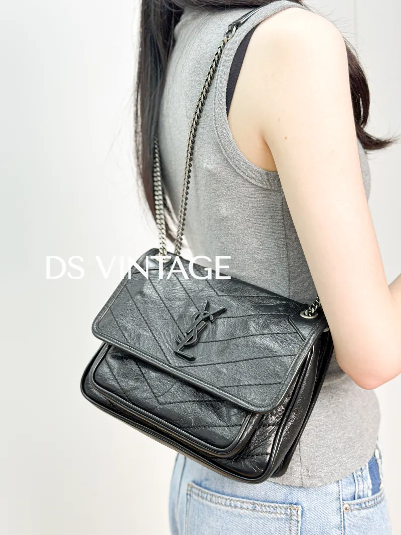 SAINT LAURENT Crossbody Bag Niki Black Waxed Leather Calfskin Small 21 × 7.5 × 16 cm — on-model view 3 of 3