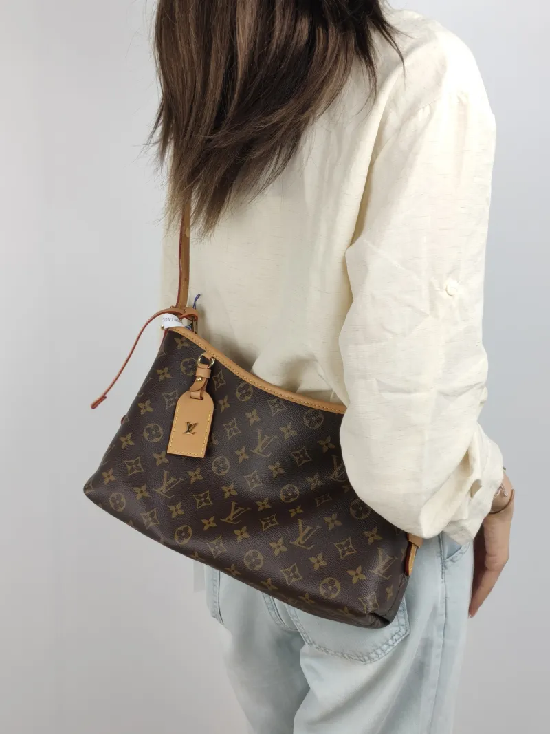 Louis Vuitton Shoulder Bag Carryall East West Monogram PVC 36 × 10 × 19 cm — on-model view 2 of 2