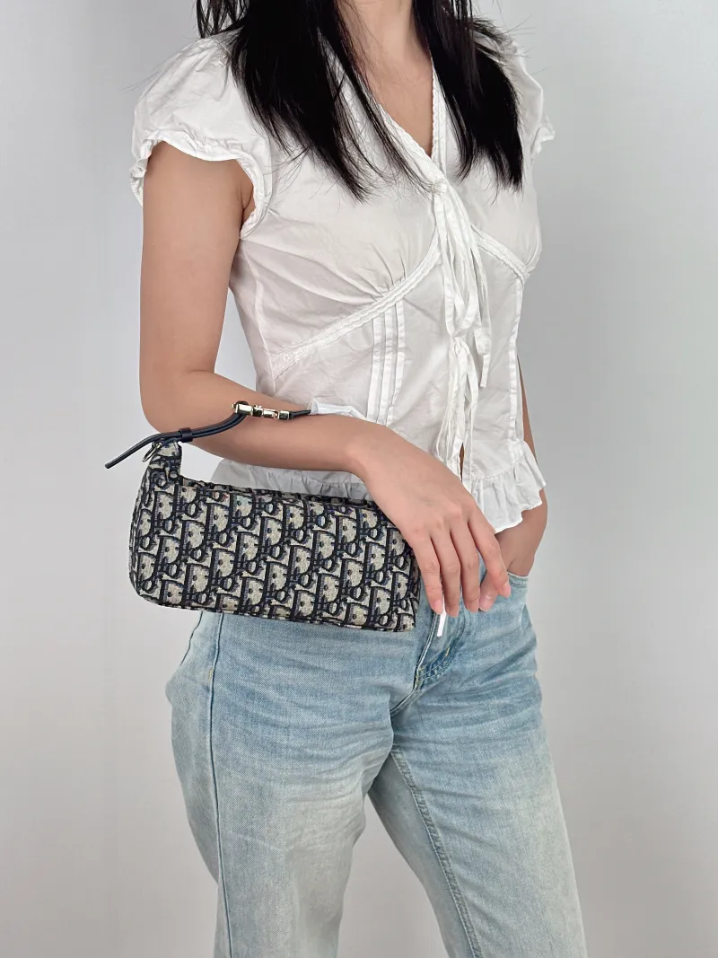 DIOR Top Handle Bag Travel Nomad Blue Canvas Medium 22 × 9.5 × 13 cm — on-model view 1 of 2