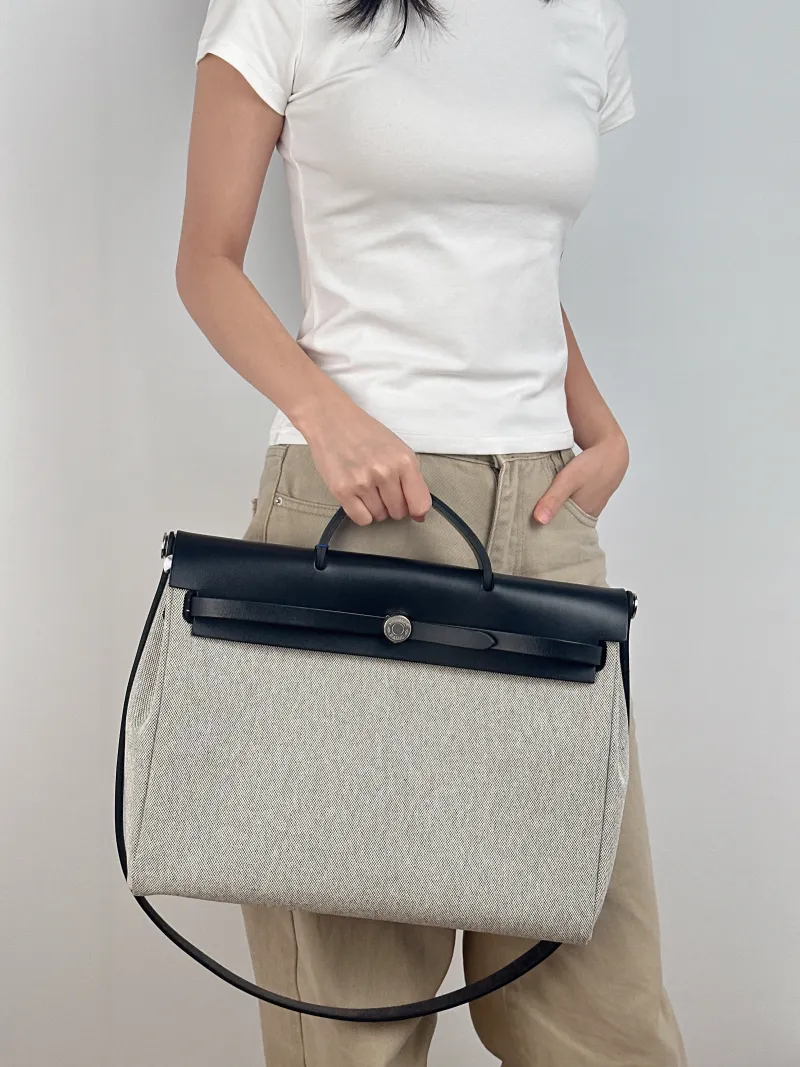 Hermès Top Handle Bag herbag messenger 39 Top Handle Bag Beige Black Canvas · Calfskin One Size 36 × 9 × 28 cm k — on-model view 2 of 3