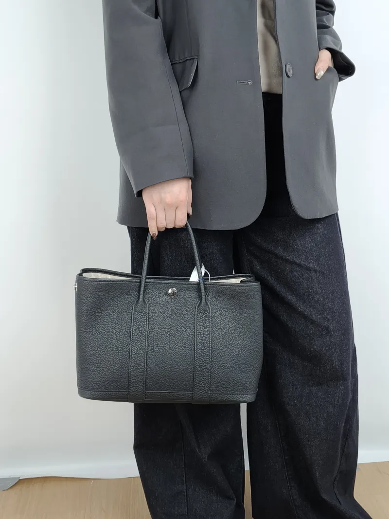 Hermès Top Handle Bag Garden Party 30 30 Black Negonda Calfskin Medium 30 × 13 × 21 cm G — on-model view 4 of 5