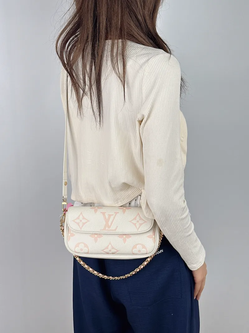 Louis Vuitton Crossbody Bag IVY White · Pink Empreinte Embossed Calfskin Small 23.5 × 4.3 × 12 cm — on-model view 2 of 2