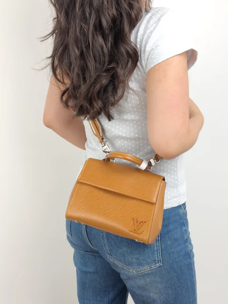 Louis Vuitton Crossbody Bag CLUNY Yellow Epi Embossed Calfskin Mini 20 × 7.5 × 16 cm — on-model view 1 of 3