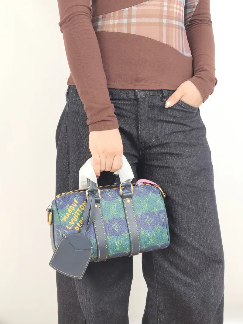 Louis Vuitton Crossbody Bag Keepall 25 Green Blue Monogram PVC Medium 25 × 11 × 15 cm — on-model view 2 of 3