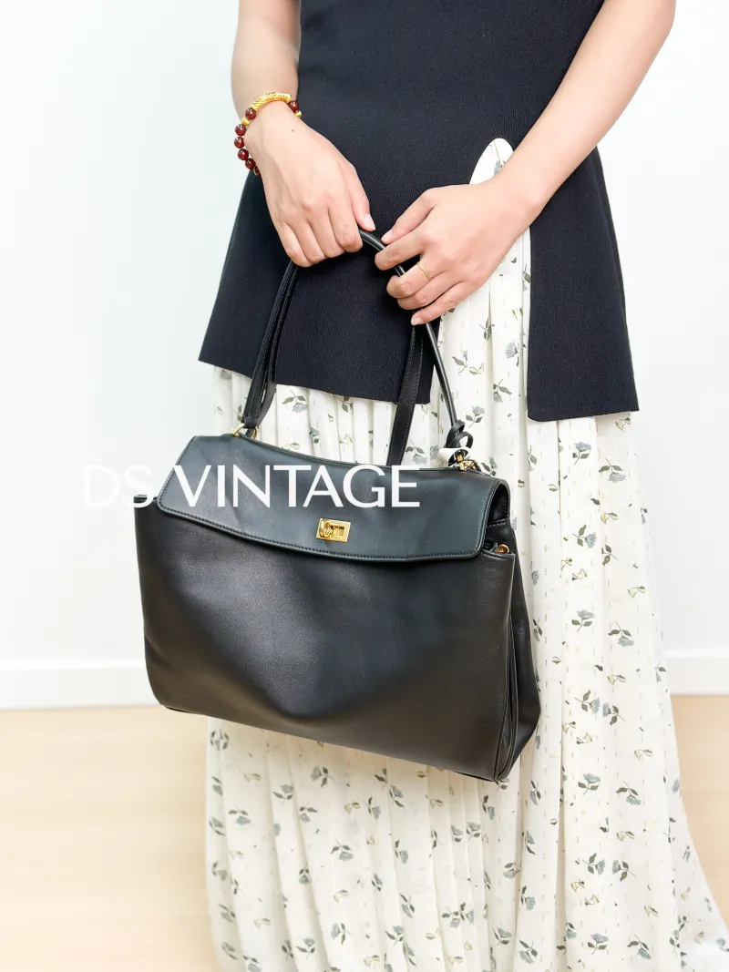 BALENCIAGA Crossbody Bag RODEO Black CC alfskin Medium35 × 11 × 23.5 cm — on-model view 1 of 3