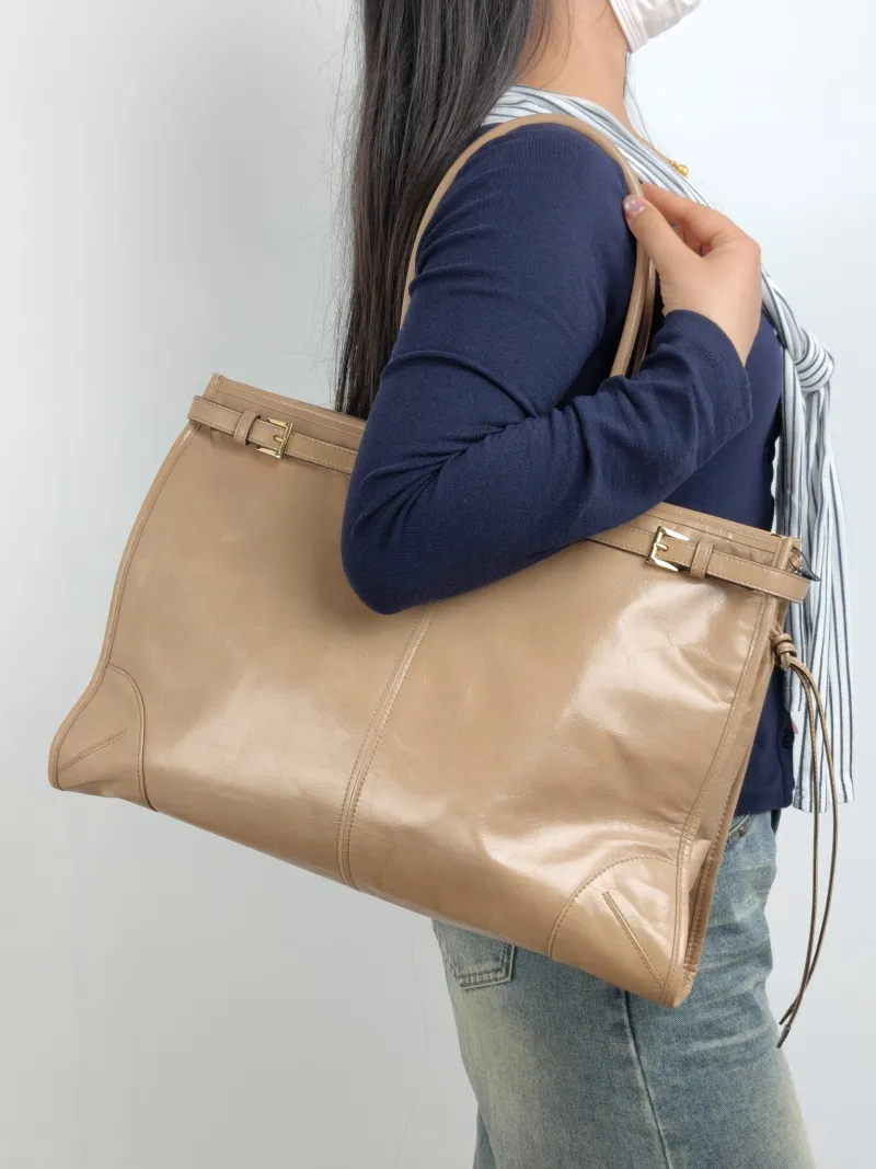 PRADA Shoulder Bag Bonnie Soft Lux Taupe Waxed Leather 42 × 12 × 30 cm — on-model view 2 of 2