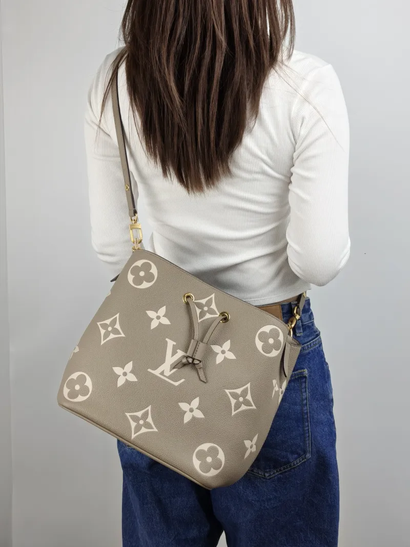 Louis Vuitton Shoulder Bag NÉONOÉ Bucket Bag · White Monogram Empreinte Embossed Calfskin Medium 26 × 17.5 × 26 cm — on-model view 1 of 2