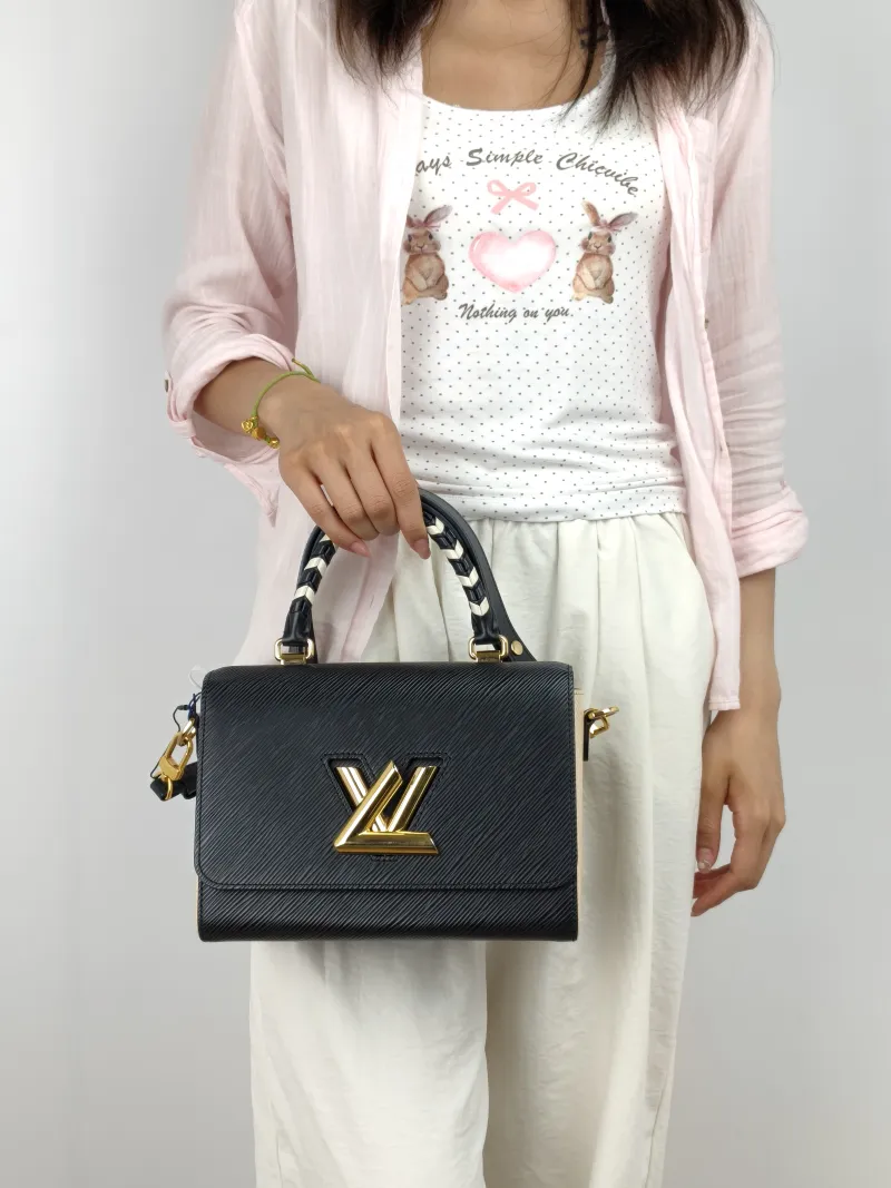 Louis Vuitton Crossbody Bag Crafty Twist Black · White Epi Embossed Calfskin Medium 23 × 9.5 × 17 cm — on-model view 2 of 3