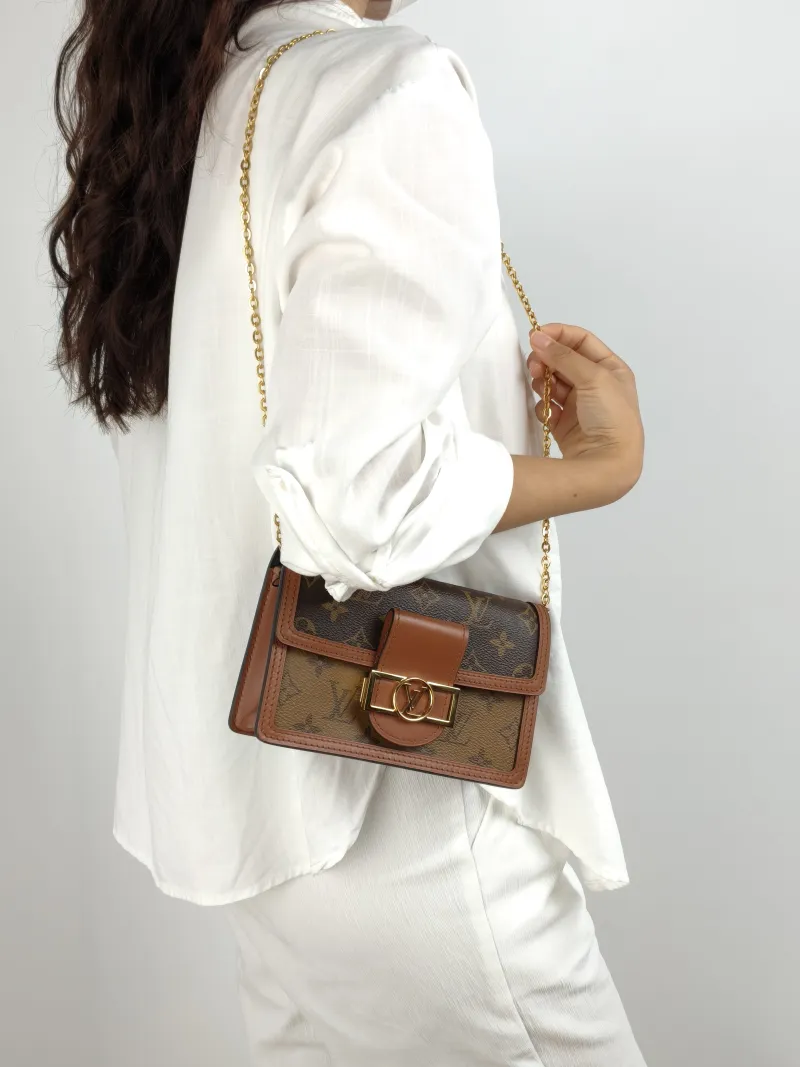 Louis Vuitton Crossbody Bag Dauphine Woc Woc Monogram PVC One Size 18.5 × 5 × 12 cm — on-model view 1 of 2
