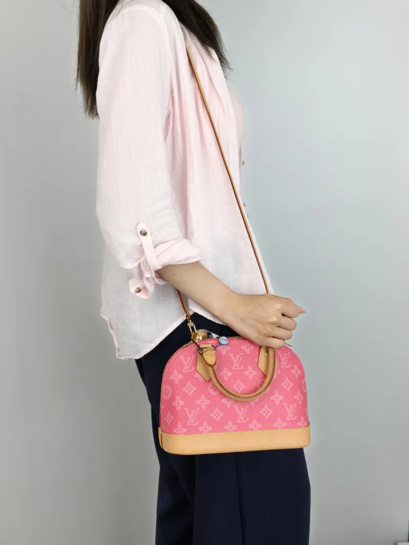 Louis Vuitton Top Handle Bag Alma BB Pink PVCBB23.5 × 11.5 × 17.5 cm — on-model view 2 of 3