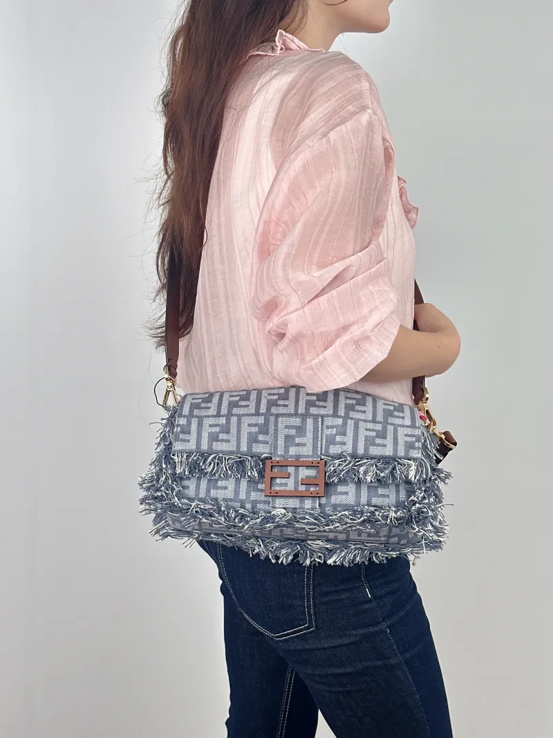 FENDI Crossbody Bag Baguette Baguette Bag Blue Canvas Medium 27 × 6 × 15 cm — on-model view 1 of 2