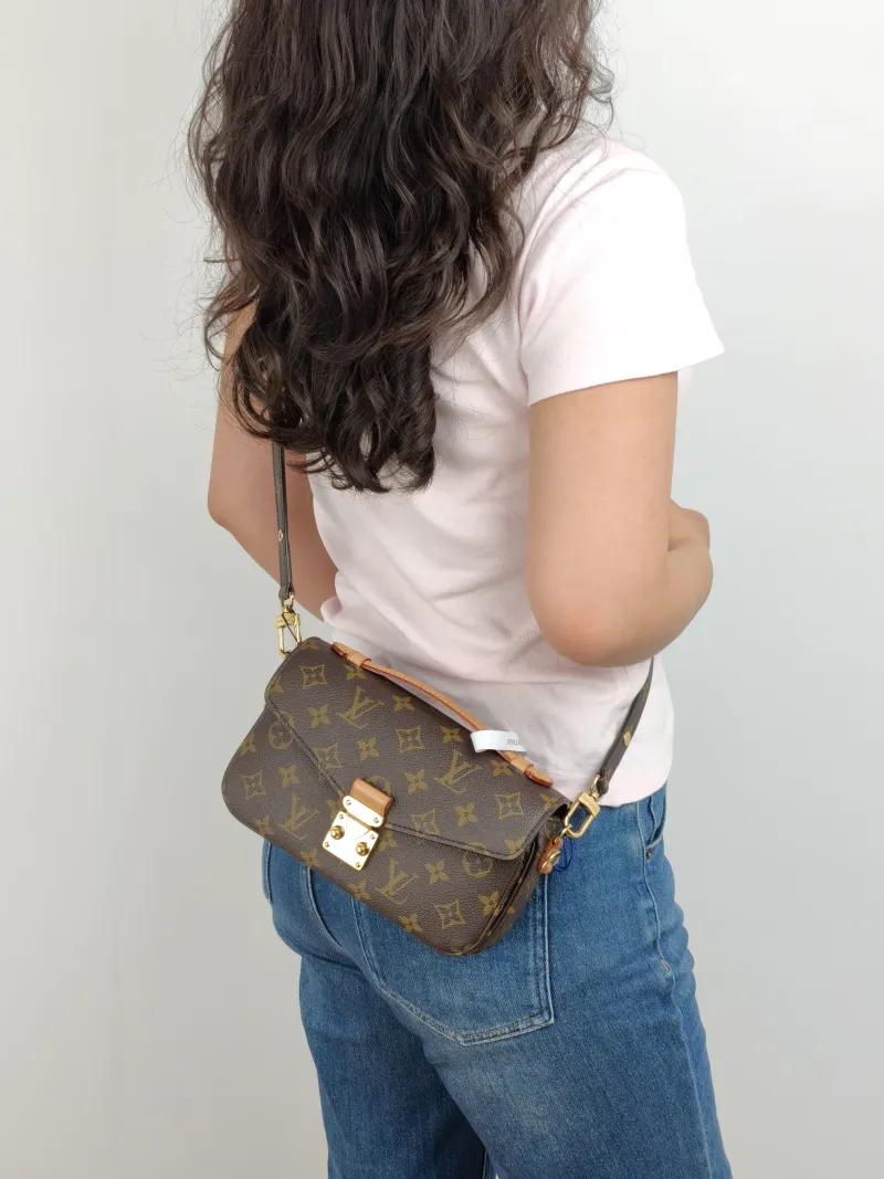 Louis Vuitton Crossbody Bag Pochette Métis East West Monogram PVC Small 21.5 × 6 × 13.5 cm — on-model view 1 of 3
