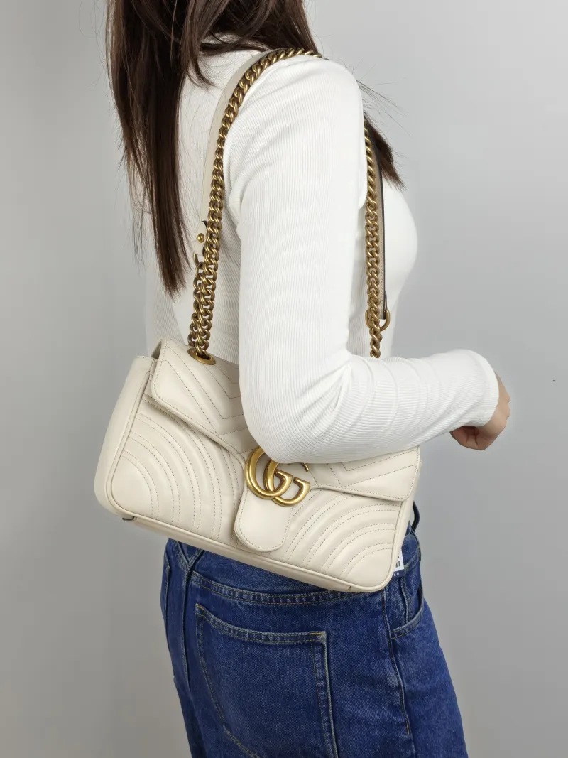 GUCCI Crossbody Bag GG Marmont Medium Marmont 26 White Calfskin 26 × 7 × 15 cm — on-model view 1 of 2