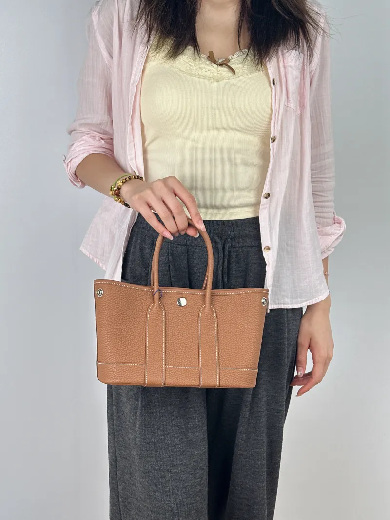 Hermès Top Handle Bag Neo Garden 23 Mini Negonda Calfskinmini23 × 10 × 16 cm — on-model view 1 of 2